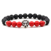 bracelet lion's head in silver and red and black pearls
