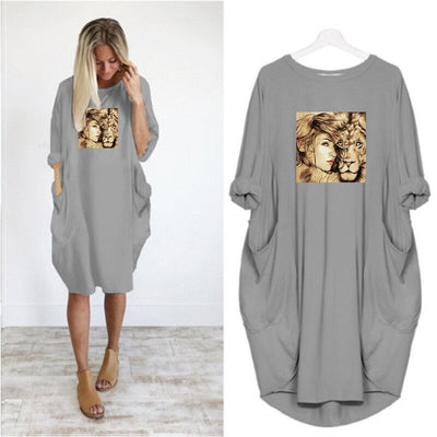 dress with a golden flocking of a woman and a lion cuddling
