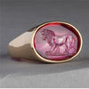 ring engraved with a lion on a red background