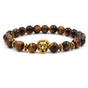 bracelet lion's head in gold with dark and shiny pearl