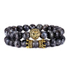 bracelet of deep black glossy pearl with gold-plated lion head