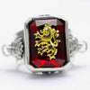ring in silver with a gold lion on a big red stone