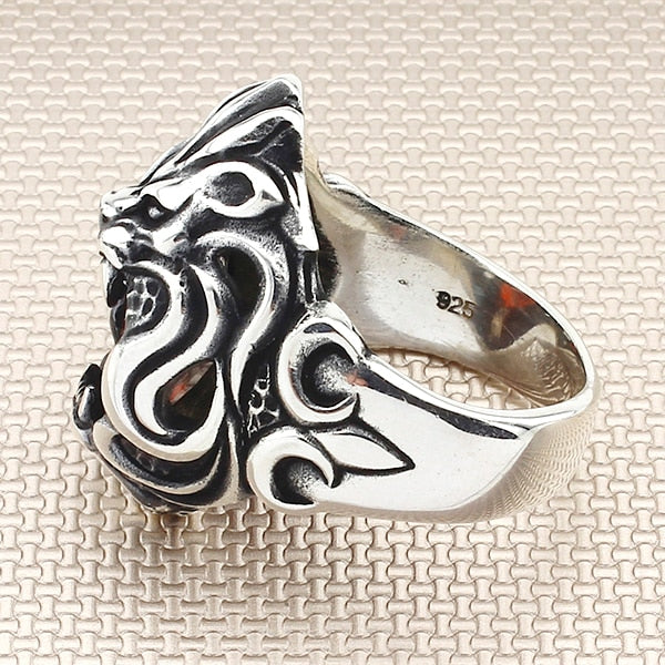 Men's Artisan Crafted Sterling Silver and Garnet Ring - Lion Power | NOVICA